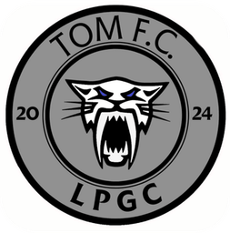 Escudo de TOM FC